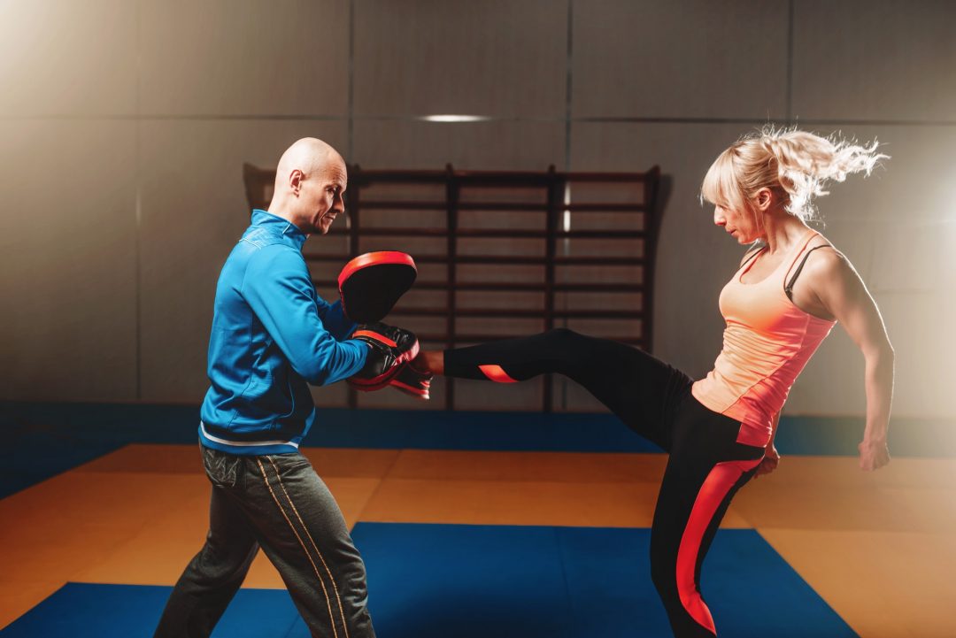 woman in actoin on self defense workout -